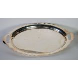 PLAIN SILVER OVAL TWO HANDLED TEA TRAY, the curved border having cyma edge and cut out handles, 21