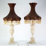 A PAIR OF LARGE ALABASTER PEDESTAL VASE SHAPE TABLE LAMPS with stepped square bass and the ornate