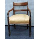 WILLIAM IV FIGURED MAHOGANY ELBOW CHAIR, the flame cut rounded top rail above a pair of downswept