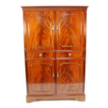 GEORGIAN STYLE MODERN REPRODUCTION FLAME CUT MAHOGANY DRINKS CABINET, the moulded cornice above a