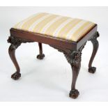 EARLY TWENTIETH CENTURY CARVED MAHOGANY PIANO STOOL, the oblong padded drop in seat, covered in olde