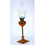 VICTORIAN COPPER TABLE OIL LAMP with slender reeded column and the Vaseline glass frilled shade