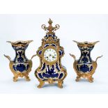 TWENTIETH CENTURY FRENCH ROCOCO POTTERY AND GILT METAL MOUNTED THREE PIECE CLOCK GARNITURE, the 3