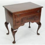 EIGHTEENTH CENTURY MAHOGANY LOW BOY, the rounded oblong top with moulded edge above one long and