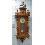 EARLY TWENTIETH CENTURY VIENNA STYLE WALNUT AND STAINED BEECH WALL CLOCK, the 6 1/2" two part