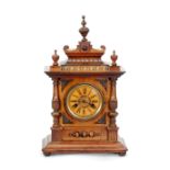 EARLY TWENTIETH CENTURY H.A.C., GERMAN, CARVED WALNUTWOOD AND BEECH MANTEL CLOCK, the 4 1/4" Roman