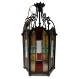 ARTS AND CRAFTS GILT BRASS AND CUT LEADED GLASS HALL LIGHT, with six multi-coloured glass panes,