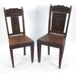 TWO NINETEENTH CENTURY FAR EASTERN CARVED HARDWOOD CHAIRS, with faux rush work carved panel seats,