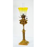 LATE 19TH CENTURY ORNATE BRASS COLUMNAR TABLE OIL LAMP, the embossed reservoir on plain brass