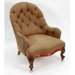 VICTORIAN MAHOGANY SPOON BACK EASY ARM CHAIR, with button back and serpentine fronted stuff over