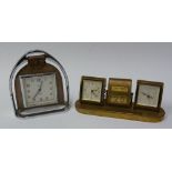 SMITH'S ART DECO WIND UP TRAVEL CLOCK, in stirrup pattern chrome plated and leather holder, 6" (15.