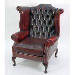 MODERN GEORGIAN STYLE WING EASY ARM CHAIR in buttoned antiqued red leather on cabriole stump