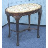 AN EDWARDIAN MAHOGANY OVAL STOOL WITH BLIND FRET FRIEZE