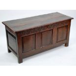 LATE SEVENTEENTH CENTURY CARVED OAK COFFER, typical form with two plank top, foliate scroll carved