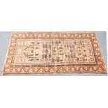 SEMI ANTIQUE CAUCASIAN RUG, with an intricate stylised tee of life design on an old ground ground,