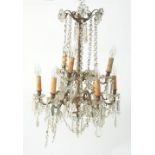 EARLY TWENTIETH CENTURY GILT METAL AND CUT GLASS NINE LIGHT ELECTROLIER, two tiered and with