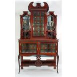 EDWARDIAN CARVED MAHOGANY DISPLAY CABINET, the centre section with bulls eye glazed 15 panel