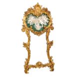 IMPRESSIVE MODERN REPRODUCTION FLORENTINE STYLE MOULDED GILT AND COMPOSITION WALL MIRROR, the shaped