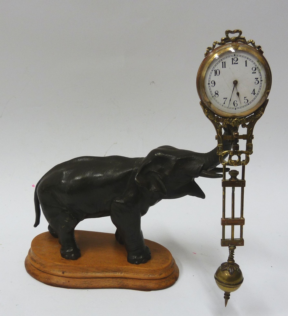 EARLY TWENTIETH CENTURY SPELTER ELEPHANT MYSTERY CLOCK, with pivoting brass cased timepiece, 2"