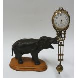 EARLY TWENTIETH CENTURY SPELTER ELEPHANT MYSTERY CLOCK, with pivoting brass cased timepiece, 2"