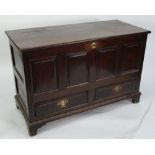 ANTIQUE OAK DOWER CHEST, the moulded oblong hinge top above four fielded panels and pair of basal