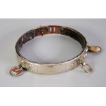 A FRENCH FIRST WORLD WAR PERIOD LEATHER LINED METAL DOG COLLAR, with two numbered registration