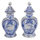 A pair of Chinese 19th century blue and white vases, of baluster form on octagonal foot, painted