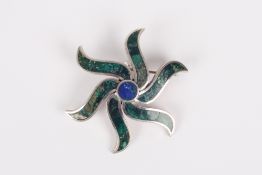 A Mexican turquoise and white metal Taxco brooch/pendant, in the form of a sunburst, the metal