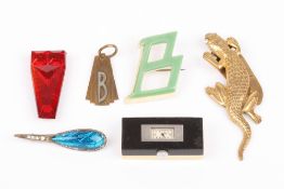 Five Art Deco design items of jewellery and a Domino watch, comprising: two dress clips, two