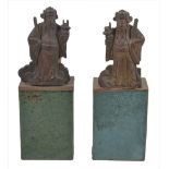 Two Chinese glazed pottery hand warmers, together with two carved gilt wood figures of