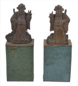 Two Chinese glazed pottery hand warmers, together with two carved gilt wood figures of