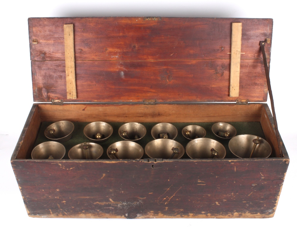 A set of twelve graduated brass hand bells, early 20th century each with leather strap and stamped - Image 2 of 3
