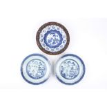 Two 19th century Chinese blue and white plates, decorated with landscape scenes, together with