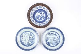 Two 19th century Chinese blue and white plates, decorated with landscape scenes, together with