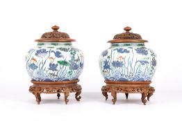 A pair of Chinese blue and white jars, possibly 18th century, painted in underglaze blue with