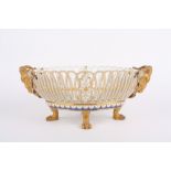 A mid to late 19th century Berlin porcelain oval basket, of pierced design, each end with gilded
