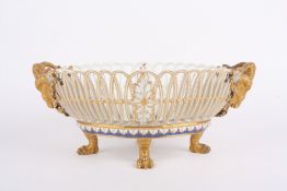 A mid to late 19th century Berlin porcelain oval basket, of pierced design, each end with gilded