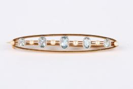 A Victorian 15ct gold, aquamarine and seed pearl bar brooch, set with five graduated oval