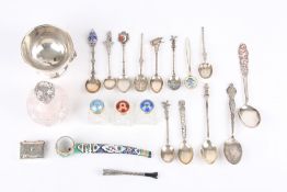 A collection of assorted silver items, including a collection of silver spoons, a painted enamel