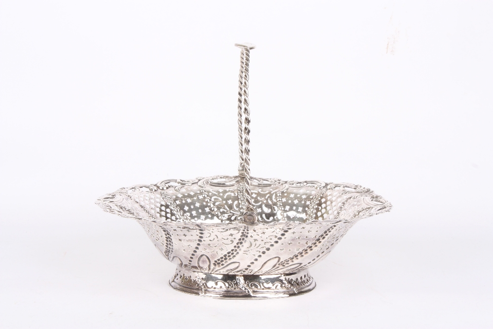 A Victorian white coloured metal bread basket, with rope twist carrying handle, and with pierced