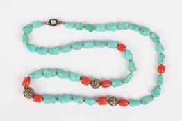 An early 20th century turquoise, coral and gilt metal necklace, the predominantly turquoise