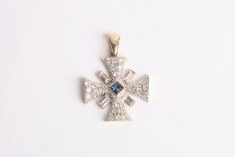A Modern costume jewellery pendant in the form of a cross, with pave set and baguette cut paste