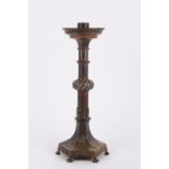 A large 19th century style French bronzed candlestick, with ring turned shaft and central rope twist