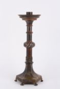 A large 19th century style French bronzed candlestick, with ring turned shaft and central rope twist