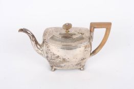 A silver bachelors teapot, hallmarked London 1884, of squat form with reeded borders, wooden