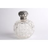 A large Victorian silver and cut glass scent bottle, hallmarked Birmingham 1897, the embossed lid