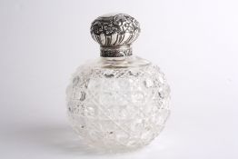 A large Victorian silver and cut glass scent bottle, hallmarked Birmingham 1897, the embossed lid