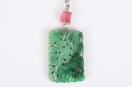 A Chinese jade pendant, of rectangular form carved on both sides with bamboo and flowers, the jade