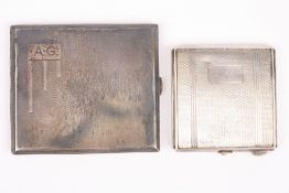 Two engine turned silver cigarette cases, hallmarked Birmingham 1932 and and 1948 (2). 6.2 ozt .