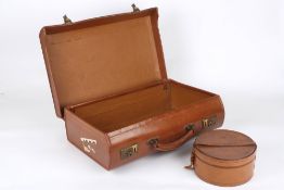 A vintage tan leather briefcase, with initials ESI, together with a brown leather circular collar